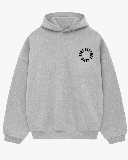 Riot Leveret Club Legacy Oversized Hoodie in gray, 450 GSM heavyweight French Terry, front view showing structured hood and dropped shoulder silhouette.